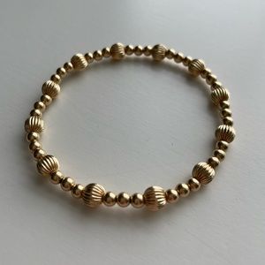 E Newton extends gold stretch bracelet